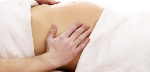 Pregnant woman having a prenatal massage at Clarity Massage and Wellness